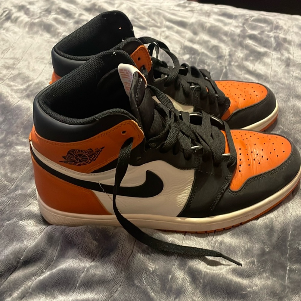 bright orange and black nike air jordan’s $150